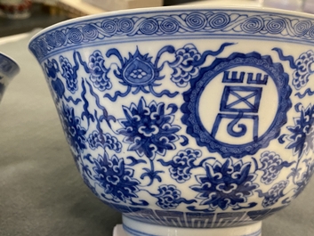 A pair of Chinese blue and white 'wan shou wu jiang' bowls, Qianlong mark and of the period