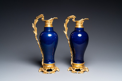 A pair of Chinese monochrome blue vases with gilt bronze ewer mounts, Qianlong and 19th C.