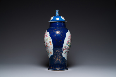 A Chinese blue-ground famille rose vase and cover, Kangxi mark, 19th C.