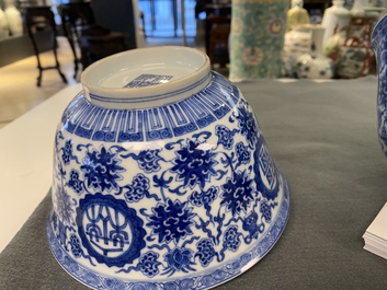 A pair of Chinese blue and white 'wan shou wu jiang' bowls, Qianlong mark and of the period