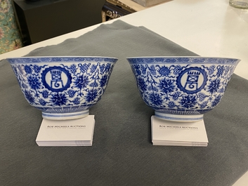 A pair of Chinese blue and white 'wan shou wu jiang' bowls, Qianlong mark and of the period