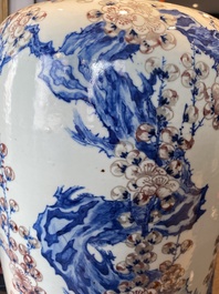 An exceptional Chinese blue, white and copper-red 'meiping' vase with prunus blossoms, 18th C.
