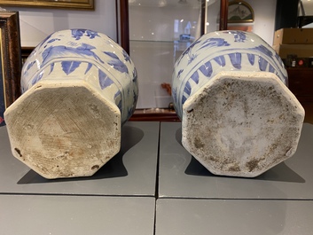 A pair of Chinese blue and white vases and covers with narrative design, Transitional period