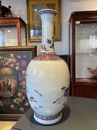 A Chinese blue, white and copper red 'antiquities' bottle vase, Qianlong