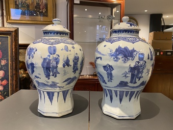 A pair of Chinese blue and white vases and covers with narrative design, Transitional period