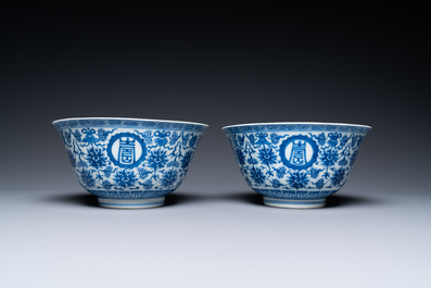 A pair of Chinese blue and white 'wan shou wu jiang' bowls, Qianlong mark and of the period