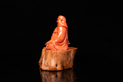 A Chinese carved red coral 'Buddha' figure, Republic