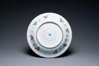 A pair of Chinese famille verte 'mythical animals' dishes, seal marks, Kangxi