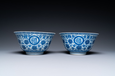 A pair of Chinese blue and white 'wan shou wu jiang' bowls, Qianlong mark and of the period