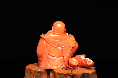 A Chinese carved red coral 'Buddha' figure, Republic
