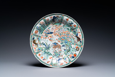 A pair of Chinese famille verte 'mythical animals' dishes, seal marks, Kangxi