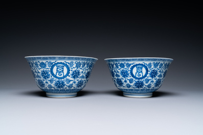 A pair of Chinese blue and white 'wan shou wu jiang' bowls, Qianlong mark and of the period