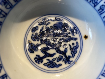 A Chinese blue and white 'dragon' bowl with lanca-characters, Wanli mark and of the period