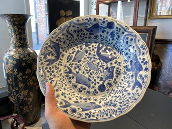 A pair of Chinese lobed blue and white 'fish' dishes, Kangxi