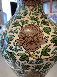 A Chinese verte biscuit 'peony scroll' vase, Ming