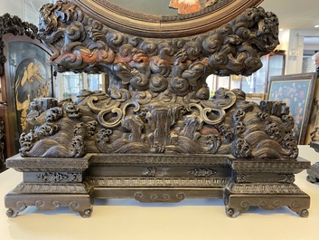 A pair of Chinese wooden table screens with soapstone- and bone-embellished medallions, 18/19th C.