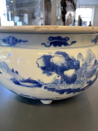 A Chinese blue and white 'landscape' tripod censer with later wooden cover and stand, Kangxi