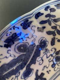 A Chinese blue and white lobed 'crab and fish' dish, Yu mark, Kangxi