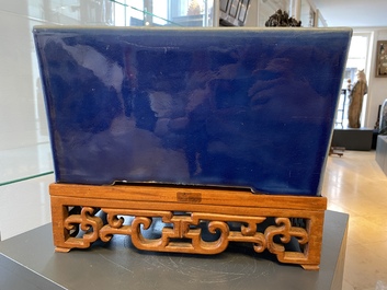 A Chinese rectangular blue-glazed jardini&egrave;re on wooden stand, 19th C.