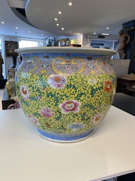 A large Chinese famille rose yellow-ground fish bowl with fine floral scrolls, 19th C.