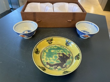 A pair of Chinese blue, white and iron-red cups and a yellow-ground 'dragon' dish, Guangxu mark and of the period