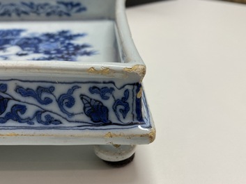 A Dutch Delft blue and white square footed tray on ball feet with chinoiserie design, late 17th C.