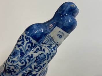 Two Dutch Delft blue and white figures of a Chinese man and woman, 1st quarter 18th C.