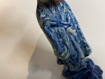 Two Dutch Delft blue and white figures of a Chinese man and woman, 1st quarter 18th C.