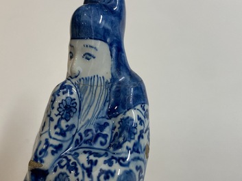 Two Dutch Delft blue and white figures of a Chinese man and woman, 1st quarter 18th C.