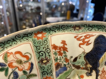 A pair of Chinese famille verte 'mythical animals' dishes, seal marks, Kangxi