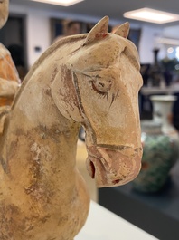 A Chinese painted pottery 'lady on horseback' group, Tang