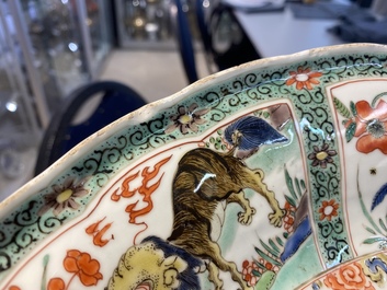 A pair of Chinese famille verte 'mythical animals' dishes, seal marks, Kangxi