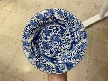 A pair of Chinese blue and white lobed 'phoenix and monkey' plates, Kangxi