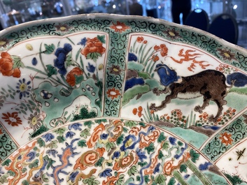 A pair of Chinese famille verte 'mythical animals' dishes, seal marks, Kangxi