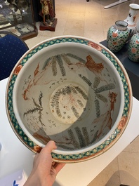 A Chinese famille verte 'war scene' fish bowl, 19th C.