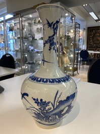 A rare Chinese blue and white bottle vase with a tiger and two butterflies, Transitional period
