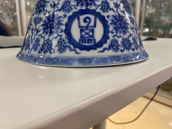 A pair of Chinese blue and white 'wan shou wu jiang' bowls, Qianlong mark and of the period