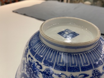 A pair of Chinese blue and white 'wan shou wu jiang' bowls, Qianlong mark and of the period