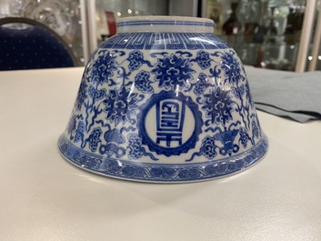 A pair of Chinese blue and white 'wan shou wu jiang' bowls, Qianlong mark and of the period