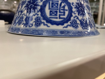 A pair of Chinese blue and white 'wan shou wu jiang' bowls, Qianlong mark and of the period