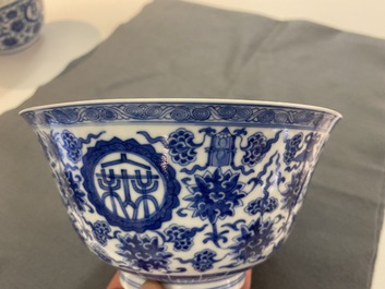 A pair of Chinese blue and white 'wan shou wu jiang' bowls, Qianlong mark and of the period