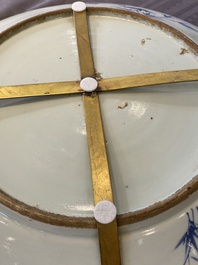 A large Chinese blue and white dish and a floral bowl, 19th C.