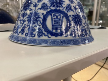 A pair of Chinese blue and white 'wan shou wu jiang' bowls, Qianlong mark and of the period