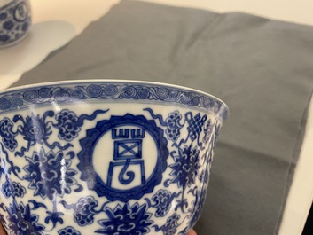 A pair of Chinese blue and white 'wan shou wu jiang' bowls, Qianlong mark and of the period