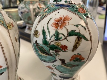 Une garniture de quatre vases en porcelaine de Chine famille verte &agrave; d&eacute;cor d'animaux mythiques, Kangxi