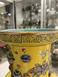 A Chinese yellow-ground famille rose rouleau vase with applied 'antiquities' design, 19th C.