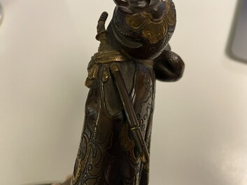 A Japanese patinated and gilded bronze figure of a warrior, signed Miyao, Meiji, 19th C.