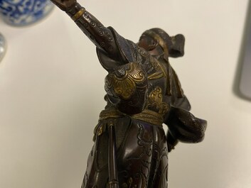 A Japanese patinated and gilded bronze figure of a warrior, signed Miyao, Meiji, 19th C.