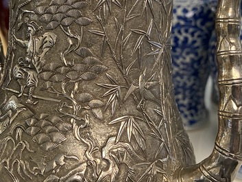 A Chinese silver teapot with birds among blossoming branches, 19th C.