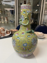 A Chinese yellow-ground famille rose bottle vase, 19th C.
